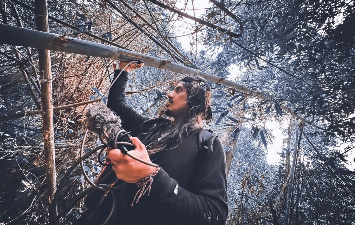 DJ Edwin Carrasco, known in the artistic world as Tayta Bird, recording sounds of a rainforest. Image courtesy of Tayta Bird